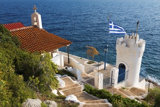 Small chapel with Greek flag and sea view, Church of Agios Nikolaos Krasoktistos, Agia Kyriaki,