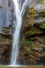 Waterfall over rocks in the rainforest in Minas Gerais