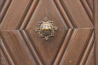 Stahlesches Schwesternhaus in the street Eisgrube in Bamberg. Doorknob with a cheerful face, known