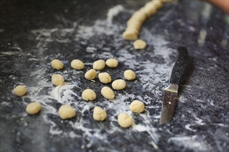 Swabian cuisine, preparation of broad beans with yeast dumplings, worktop with raw yeast balls,