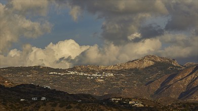 Landscape with mountains and clouds in the sky, Pigadia, town and harbour, Pigadia Bay, main town,