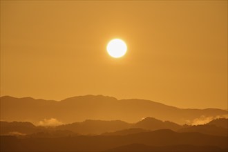 Atmospheric landscape scene at sunrise, landscape in twilight with soft fog, autumn, Bergen, North