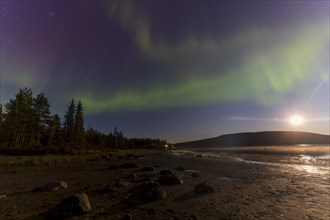 Northern lights, (Aurora borealis) at a lake near Kiruna, September 2024, Lapland, Sweden, Europe