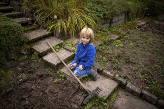 Little boy, 6 years, blonde, gardening, rake, allotment, Stuttgart, Baden-Württemberg, Germany,