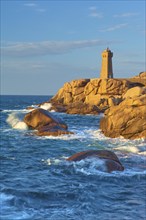 Lighthouse, Phare de Mean Ruz or Phare de Ploumanach, in the foreground rocky coastal landscape,