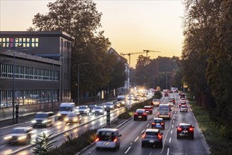 City centre street with heavy traffic in the evening. Dynamic light trails with long exposure time.