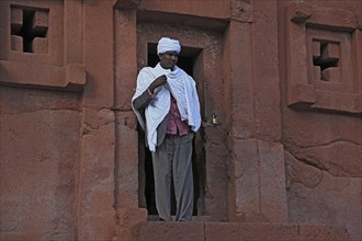 Lalibela, eastern group of rock-hewn churches, pilgrims at the entrance to the Bete Abba Lebanon,