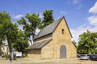 Remains of a historic church in Romanesque style with original vestibule made of natural stone from