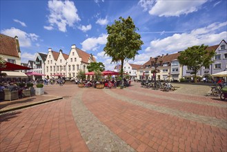 Market square under a blue sky with cumulus clouds in the pedestrian zone of Haltern am See, Ruhr