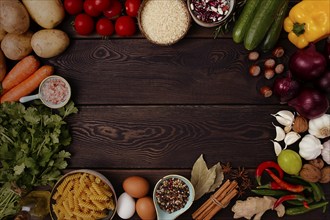 Assortment of ingredients and spices, for cooking, on a wooden background, concept, top view, food