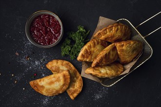 Fried mini pasties, with red sauce, top view, close-up, no people, selective focus