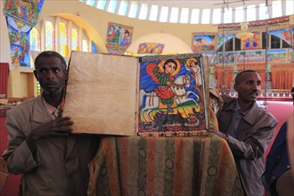 Tigray region, Axum, Aksum, St Mary's Cathedral, Maryam Tsion, inside, church servant shows old