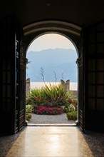 View from the inside of a city villa, light, sun, sunbeam, backlight, dramatic, architecture,