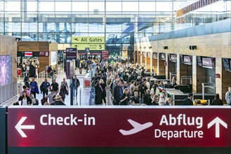 Berlin-Brandenburg BER Airport. Passengers in Terminal 1 waiting for check-in and security control