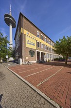 Deutsche Post AG, post office at Berliner-Tor-Platz and television tower against blue sky with