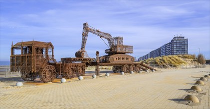 Caterpillar + Flatbed Trailer, artwork by Belgian neo-conceptual artist Wim Delvoye at seaside