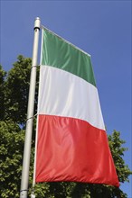 Italian national flag against a blue sky