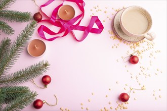 Christmas or New Year frame composition. Decorations, red balls, fir and spruce branches, cup of