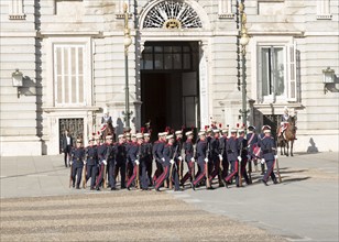 Marching soldiers in traditional dress uniform, Palacio Real royal palace, Madrid, Spain, Europe