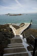 Rosaire Steps ferry dock at low tide, Island of Herm, Channel Islands, Great Britain