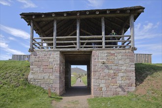 Reconstructed gate tower with rampart at the open-air museum, archaeological excavation site,