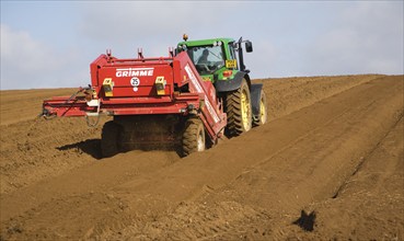 Grimme 25 de-stoner machinery preparing soil for crop of potatoes in a field, Shottisham, Suffolk,