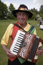 Portrait of accordion player for Morris dancers at country folk event, Shottisham, Suffolk,