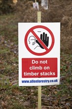 Forestry tree felling signs on Upper Hollesley Common, Suffolk, England, UK, Do not climb on timber