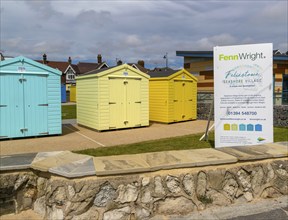 Fenn Wright estate agent sign Seashore Village beach huts for sale, Felixstowe, Suffolk, England,