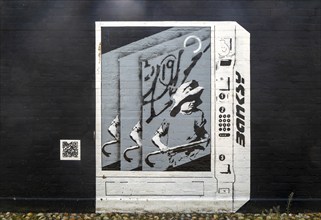 Artwork painted on wall 'Banksy art vending machine' by Joe Thompson, Lowestoft, Suffolk, England,