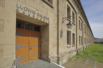 Entrance and door of the Ludwig Galerie with inscription and banner, Museum, Saarlouis, Saarland,