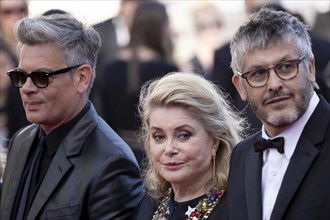 Cannes, France, 21 May 2024: Benjamin Biolay, Catherine Deneuve and Christophe Honore at the