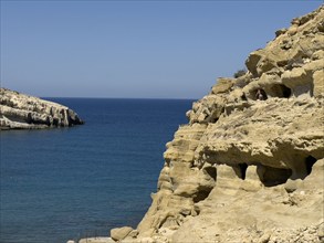 View of entrances of caves in sandstone rocks of former Roman necropolis with sandstone caves