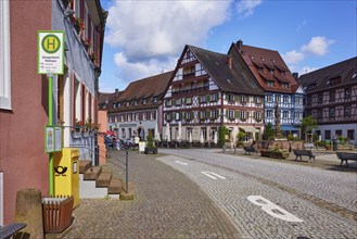 Bus stop Gengenbach town hall and mailbox with street and half-timbered houses in Gengenbach, Black