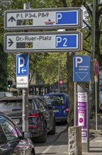 Parking in public spaces via parking app, EasyPark, here in Bochum, parking ticket machine where