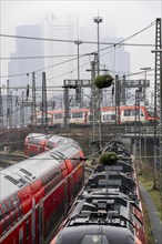 Railway tracks with regional trains, after freezing rain, in front of Frankfurt main station,