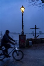 High water on the Rhine at Düsseldorf-Kaiserswerth, foggy weather, riverside paths and Rhine