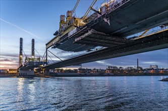 New construction of the motorway bridge Neuenkamp of the A40, over the Rhine near Duisburg, evening