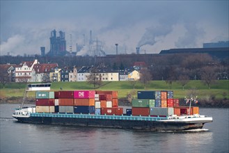 The river Rhine near Duisburg, houses on the Rhine dyke, Laar district, Thyssenkrupp Steel