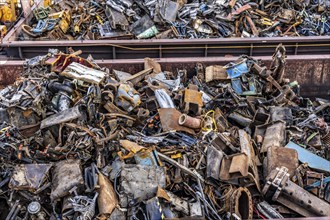 Push barge, loaded with scrap metal, for recycling, melting down, in the harbour canal,