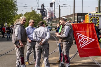 Steelworkers at a demonstration in front of the headquarters of ThyssenKrupp Steel Europe in