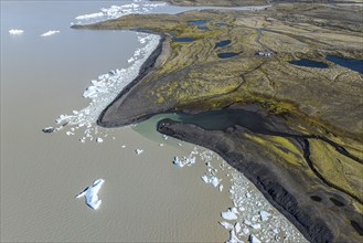 Aerial view over the glacial lake Fjallsárlón, glacier Fjallsjökull, part of Vatnajökull glacier,