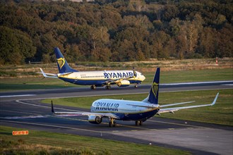 Ryanair Boeing 737 taxis to the runway, another Ryanair aircraft taxis for take-off, Cologne-Bonn