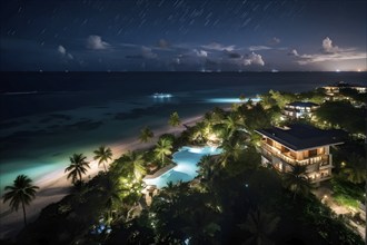 Aerial view of real estate beach resort at the Caribbean coast at night, AI generated