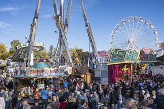 Crowd of people on fairground, amusement park, amusement ride, Ferris wheel, showmen, on the