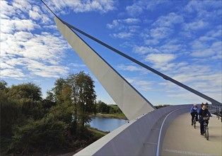 People on the Zügelgurtbruecke bridge jumping over the Emscher with the Rhine-Herne Canal,