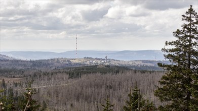 Vast mountain landscape with views of distant hills and dense forest, Harz Mountains, Brocken,