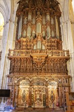 Wood-decorated organ in the magnificent interior of a cathedral, Seville