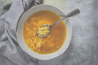 Chicken soup with noodles, homemade, no people, close-up