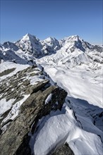 Mountain panorama with snow-covered mountain landscape in winter, view of mountain peaks